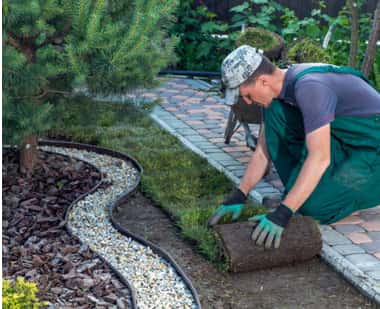 Crew laying paver edging
